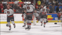 a hockey game is being played and the score is 3 to 0