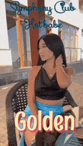 a woman is sitting in a chair with the words symphony club hot babe golden