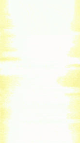 a blurred image of a person standing in front of a white background