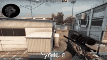a person is holding a sniper rifle in front of a building and says * yoku 'e *