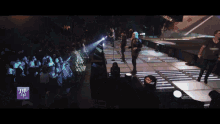 a group of people on a stage with a sign that says ' a few go '