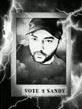 a black and white photo of a man with the words vote 4 sandy