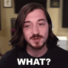 a man with long hair and a beard is asking the question what