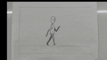 a drawing of a person walking on a white board .