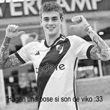 a black and white photo of a soccer player wearing a shirt that says codere