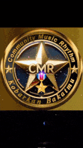 a logo for community music rhythm with a gold star in the center
