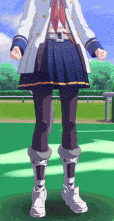 a girl in a white coat and blue skirt stands on a green field