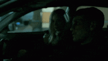a blurry picture of a car driving down a hallway in a dark room .