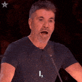 a man speaking into a microphone with the words " altogether now " on the bottom