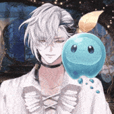 a man with white hair and a choker holds a small blue object