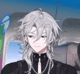 a man with long white hair is wearing a black shirt and a pearl necklace