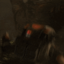 a blurred image of a person holding a gun with the number 1 on the back