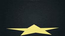 a silhouette of a person in a dark room with a yellow star in the background