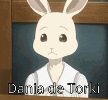 a white rabbit is looking out of a window with the words dania de torki written below it .