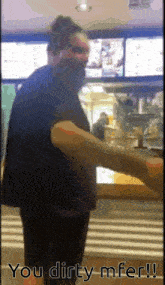 a man standing in front of a counter with the words you dirty mfer written on the bottom