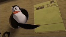 a penguin is sticking its head out of a hole next to a piece of paper that says 6957