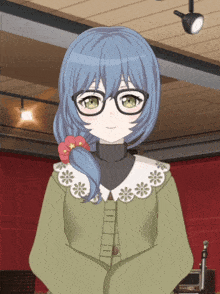 a girl with blue hair and glasses stands in front of a microphone