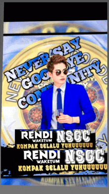a man in a blue suit and tie stands in front of a sign that says rendi nscc waketum
