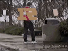 a person walking down a sidewalk with the letter r on their face