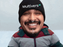 a man wearing a hat that says multivers x on it