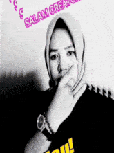 a woman wearing a hijab and a watch is covering her mouth with her hand and the words salam creations are above her
