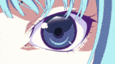 a close up of a girl 's blue eye with purple eyelashes