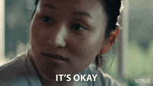 a woman says it 's okay with a netflix logo behind her