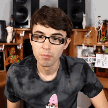 a man wearing glasses and a shirt that says patrick