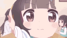 a close up of a cartoon girl 's face with a serious look on her face
