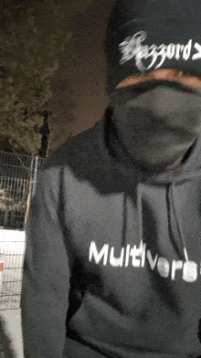 a man wearing a hoodie that says multiverse