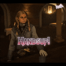 a woman sitting at a table with the words handsup written on it