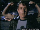 a gif of a man flexing his muscles with the words make gifs at gifsoup.com at the bottom