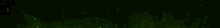 a close up of a green light beam on a dark background .