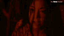 a woman in a dark room with the words mommy 's coming above her