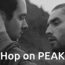 a black and white photo of two men with the words hop on peak on the bottom