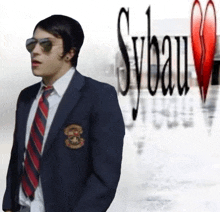 a man in a suit and tie is standing in front of a sign that says sybau