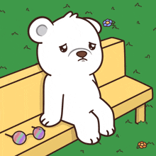 a polar bear is sitting on a bench with a pair of sunglasses next to it