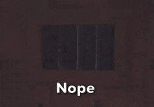 a picture of santa claus in a jail cell with the word nope below him