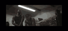 a man and a woman standing in a dark room
