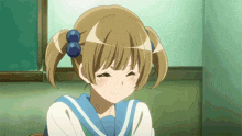 a girl with pigtails and blue bows in her hair is smiling