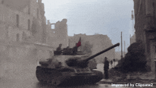 a tank is driving down a city street with the words improved by clipsww2 below it