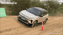 a namaste car is driving through the dirt