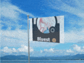 a flag with a picture of a girl and the word bluest