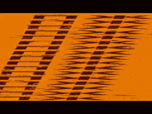 a yellow background with a black pattern that looks like a tire track