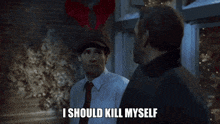 two men are standing next to each other and one of them is saying `` i should kill myself ''