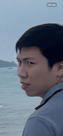 a close up of a man 's face with a sticker that says cắt xen