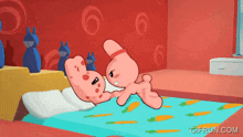 a gif from gifrun.com shows a couple of cartoon characters laying on a bed