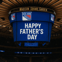 a large blue sign that says happy father 's day on it