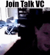 a man in a dark room with the words join talk vc