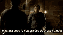two men are standing next to each other with the words magniez vous le fion espece de grosse dine